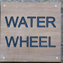 water wheel wall sign